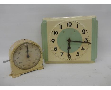 An enamel Art Deco style pale blue and cream wall clock and a Smiths 60 seconds 'stop clock'.