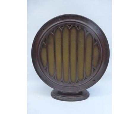 A bakelite circular speaker on stand. 