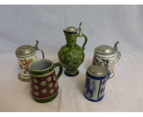 Three ceramic and pewter lidded steins, a pewter lidded ewer and a tankard in the Royal Doulton style.