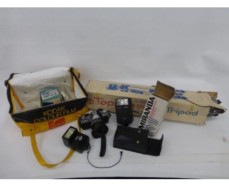 A camera bag containing two Canon cameras and two additional lenses, tripods, etc.