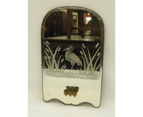An early 20th Century glass mirror with etched decoration, stork and bull rushes, with a triple candle sconce.