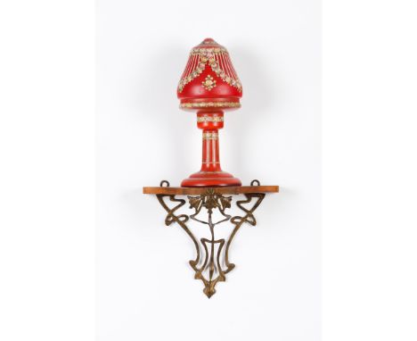 A pair of Art Nouveau lamps and brackets Red cameo glass Floral reliefs decorationPair of wooden and metal bracketsEurope, 19