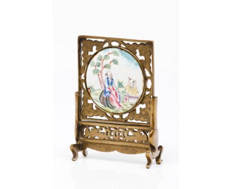 A miniature screenYellow metal of pierced and engraved decorationCentral polychrome enamel medallion on copper depicting Chin