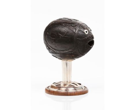 A vesselCoconut shell Profuse decoration with figures and foliage motifsMother-of-pearl eyesUnmarked silver  mounts in compli