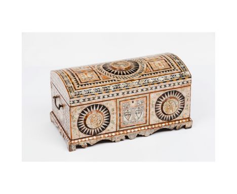 A casketWooden carcass coated in mother-of-pearl platesGreen, red and black painted Incised decoration with cartouches depict