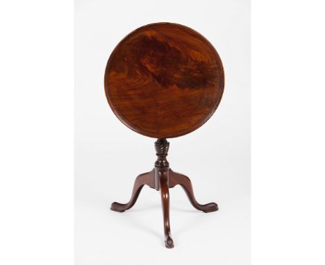 A small George III tripod tableMahogany and other timbersTilt top, central shaft of spiralled decoration, slipper feetEngland