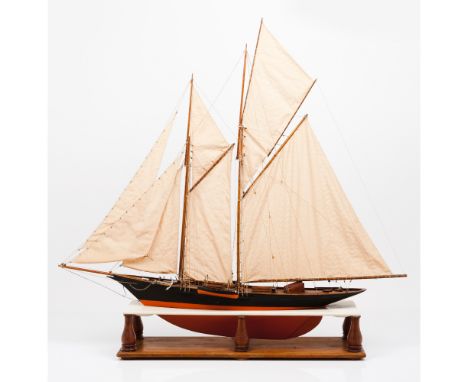 A model od a tall shipWood, textile and metal Wooden display stand20th century(evidence of woodworm)99x102