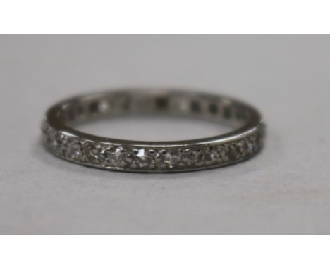 A white metal and diamond set full eternity ring, size N.