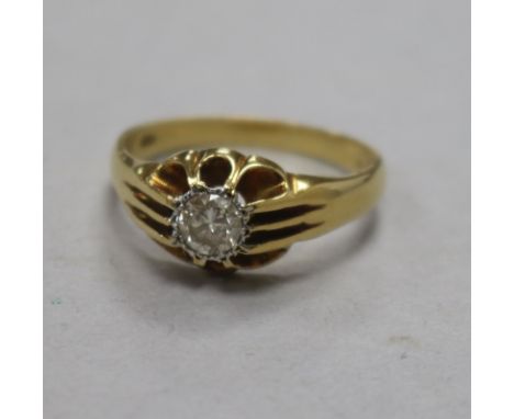 A 1960's 18ct gold and claw set solitaire diamond ring, size S.
