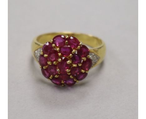 A 14ct gold and gem set cluster dress ring, size N/O.