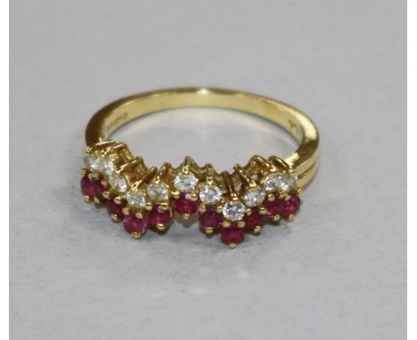 A modern 18ct gold, ruby and diamond half hoop 'zigzag' ring, size N.