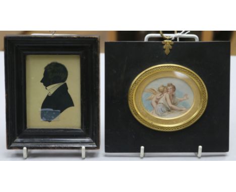 A 19th century silhouette portrait of a gentleman and an oval miniature watercolour of Cupid & Psyche in gilt-mounted ebonise