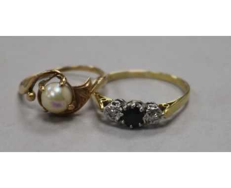 An early 20th century sapphire and diamond three stone ring and a 14ct gold and cultured pearl ring.