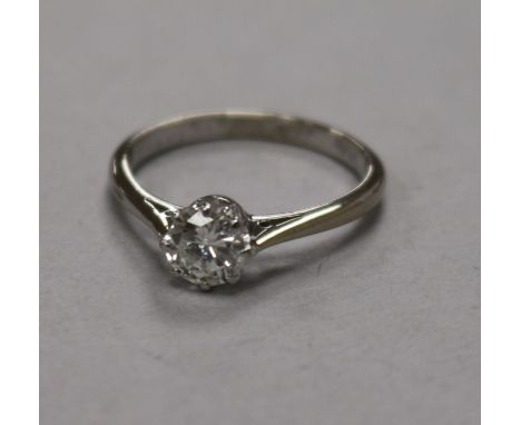 An 18ct white gold, platinum and solitaire diamond ring, size L.