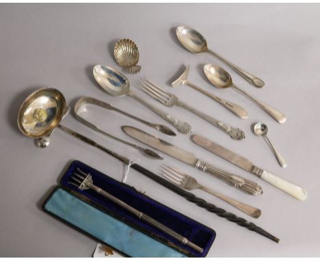 A George III silver caddy spoons and a small group of silver flatware including Victorian pickle fork and a toddy ladle.