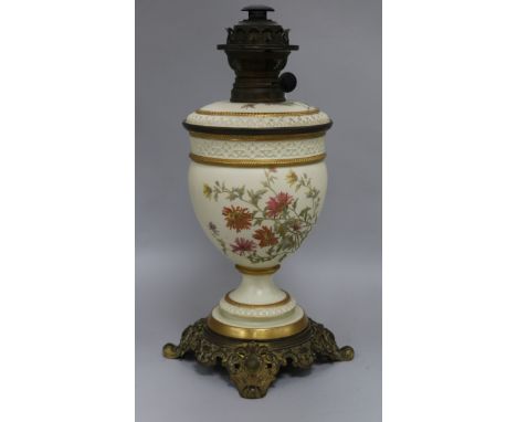 A Royal Worcester floral painted blush ground oil lamp height 42cm