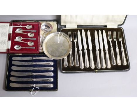 A cased set of six pairs of silver-handled fruit eaters, a similar set of six butter knives and sundries, including a cased s