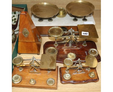A metronome, three sets of postal scales and a set of kitchen scales