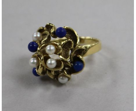 A 1980's? 14ct gold, cultured pearl and lapis lazuli set cocktail ring, size M.