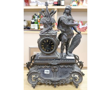 A figural mantel clock height 54cm