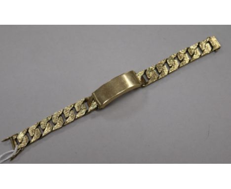 A heavy 1970's textured 9ct gold identity bracelet, 20.2cm.
