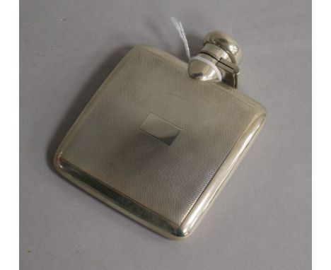 A 1940's engine turned silver hip flask, Deakin & Francis, 10.9cm.