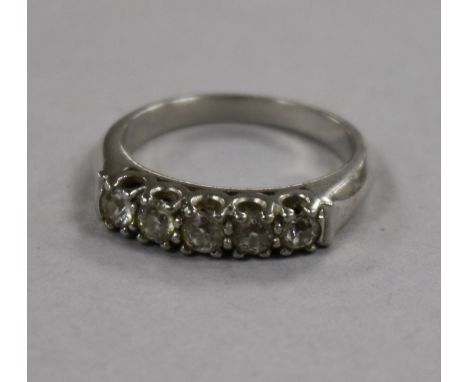 A white metal and five stone diamond ring, size M.