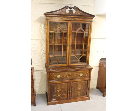 Fine quality late 19th Century rosewood and marquetry inlaid secretaire bookcase, the swan neck pediment with a central urn f