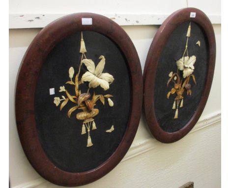 Pair of late 19th / early 20th Century Japanese oval lacquer framed panels both inset with vases of flowers, 28ins x 21.5ins 