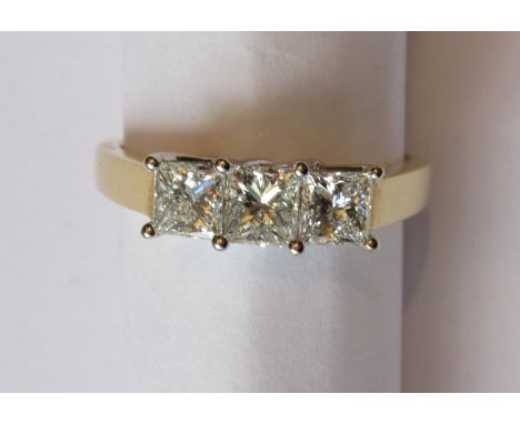 18ct White and yellow gold princess cut diamond trilogy ring, approximately 1ct total, with certificateRing size K to L 