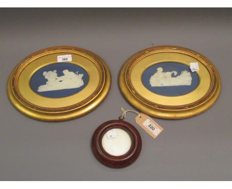 Pair of 19th Century blue and white Jasperware plaques, classical scenes, both damaged, 4.25ins x 6.25ins each, unmarked, gil
