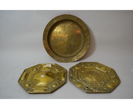 Pair of 17th Century brass wall sconces, one with a plain centre panel, the other with a profile portrait, 13ins (with damage
