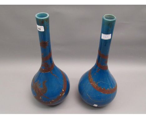 Pair of large late 19th Century Japanese pottery bottle vases decorated with dragons on a blue ground, one badly damaged, 18i