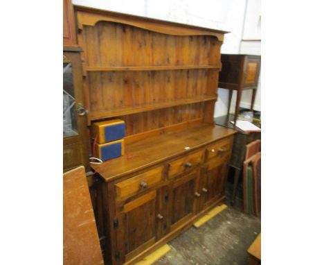 Reproduction polished pine dresser with a boarded shelf back above three drawers and three panel doors, 59.5ins wide x 17ins 