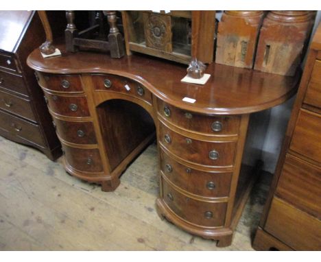Reproduction mahogany kidney shaped twin pedestal dressing table with nine drawers, raised on bracket feet, 51ins wide x 25.5