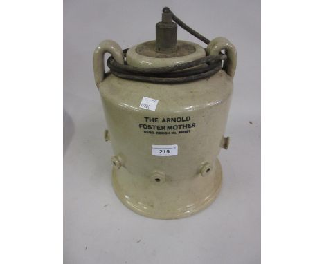 Stoneware ' The Arnold Foster Mother Lamb Feeder ', cast iron footman and a gilt metal oil lamp base 