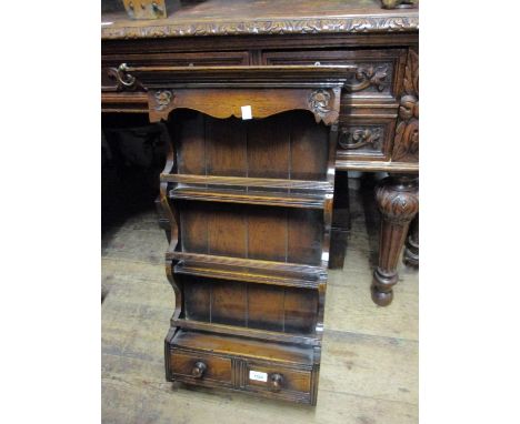 Small good quality reproduction oak wall bracket with three open shelves above two small drawers, 28ins x 13.5ins 