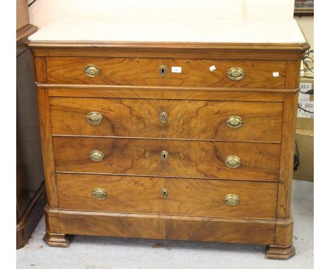 19th Century French figured walnut commode, the inset white flecked marble top above four graduated drawers with oval brass h
