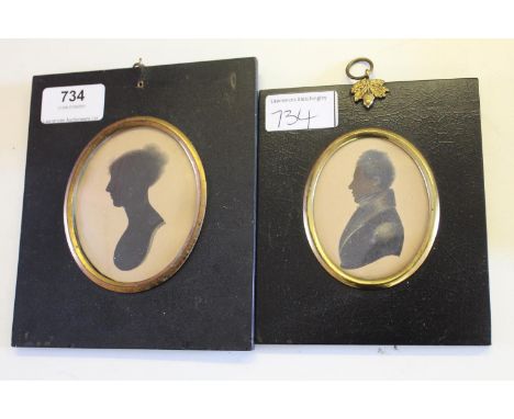 19th Century silhouette profile portrait of a gentleman, together with a similar portrait of a lady 