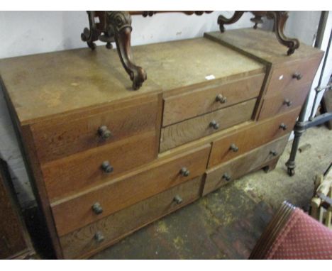 1930's Limed oak sideboard with a combination of six small drawers above four long drawers with turned knob handles raised on