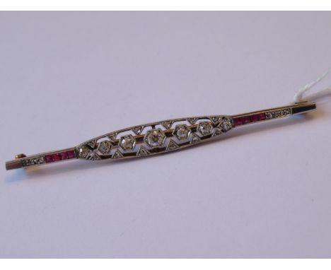 Art Deco gold bar brooch of pierced design set diamonds and rubies, 65mm wide 