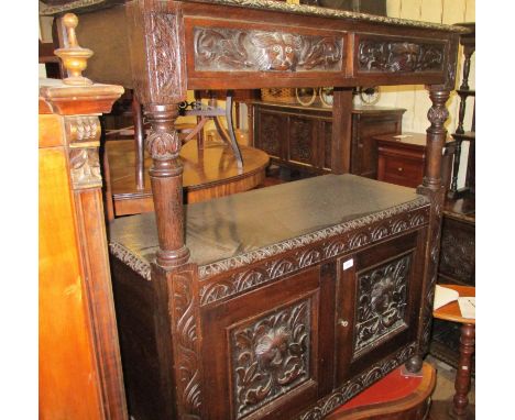 Victorian carved dark oak buffet with two drawers above an alcove and two carved panel doors, 42ins wideNo past or present wo