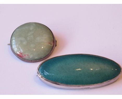 Two Art pottery silver mounted brooches 