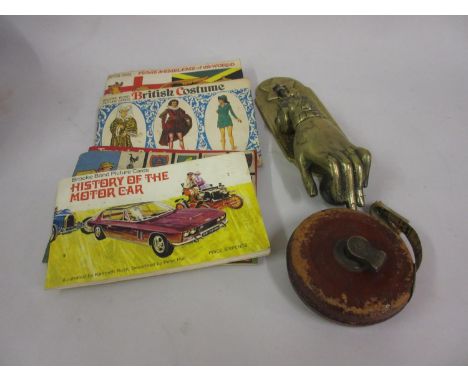 Brass door knocker in the form of a hand, quantity of tea cards and a Rabone tape measure 