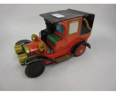 20th Century Japanese Alps tin plate battery operated early motor vehicle with driver (at fault), 9.5ins long, 6ins high 