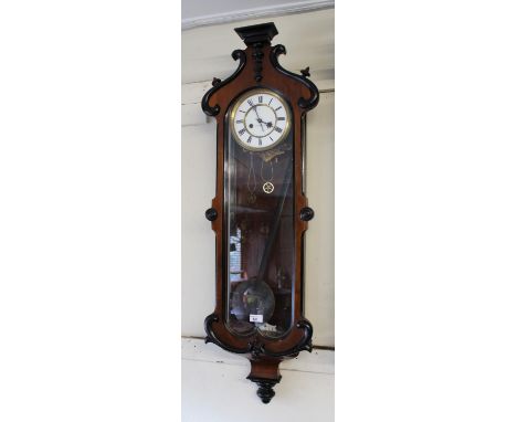 19th Century walnut and ebonised Vienna wall clock, the white enamel dial with Roman numerals, inscribed J.W. Benson, with a 