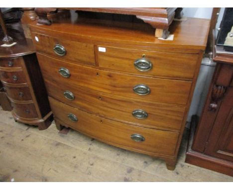 19th Century mahogany bow fronted chest of two short and three long graduated drawers with oval brass handles on bracket feet