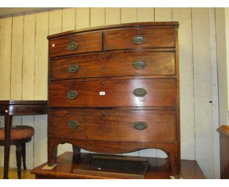 19th Century mahogany bow fronted chest of two short and three long graduated drawers with oval brass handles, raised on brac