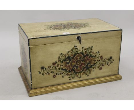 Small oriental wooden trunk with painted floral decoration on a cream ground, 23.5ins wide 