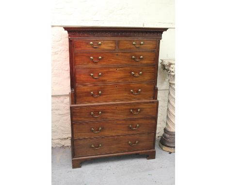 George III mahogany chest on chest, the dentil moulded cornice above two short and six long graduated drawers with brass swan